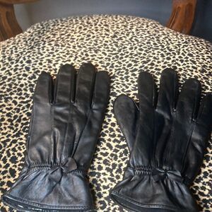 No brand black leather gloves with leather bows, good used condition